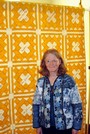Sherry Werum displays a quilt donated to her, that relates to the Owl Club, formed in Woodland in 1903.